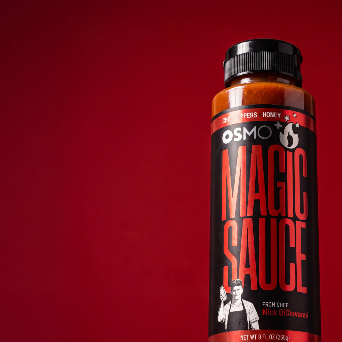 A bottle of Magic Sauce on red