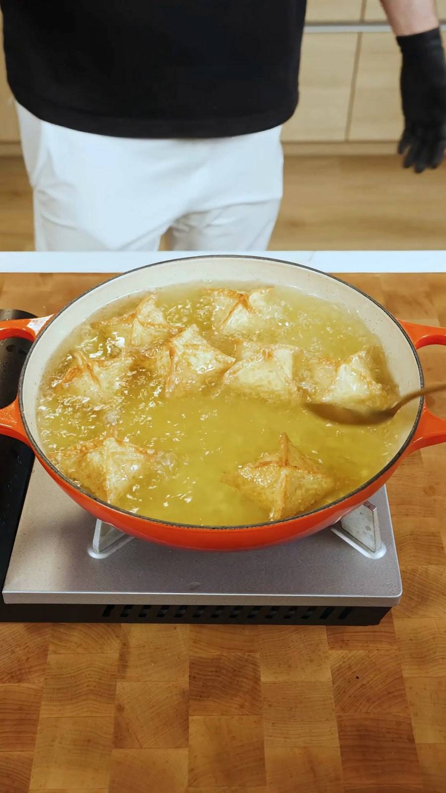 Crab rangoon fry in bubbling oil until their wrappers are golden.