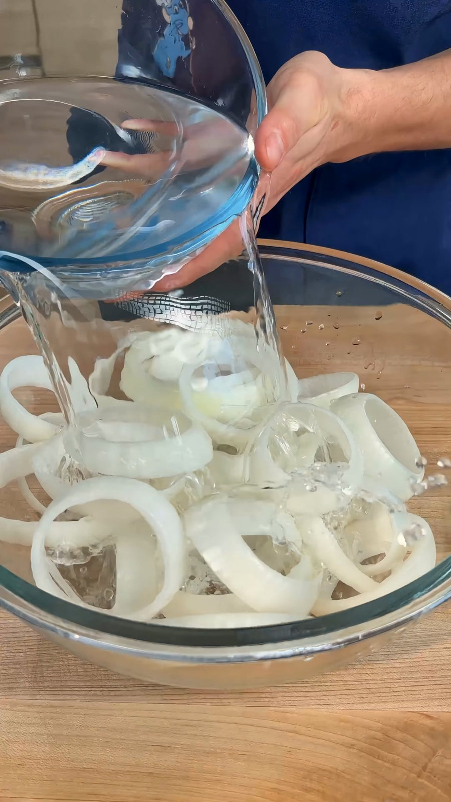 Nick pours ice-cold water over the separated onion rings.