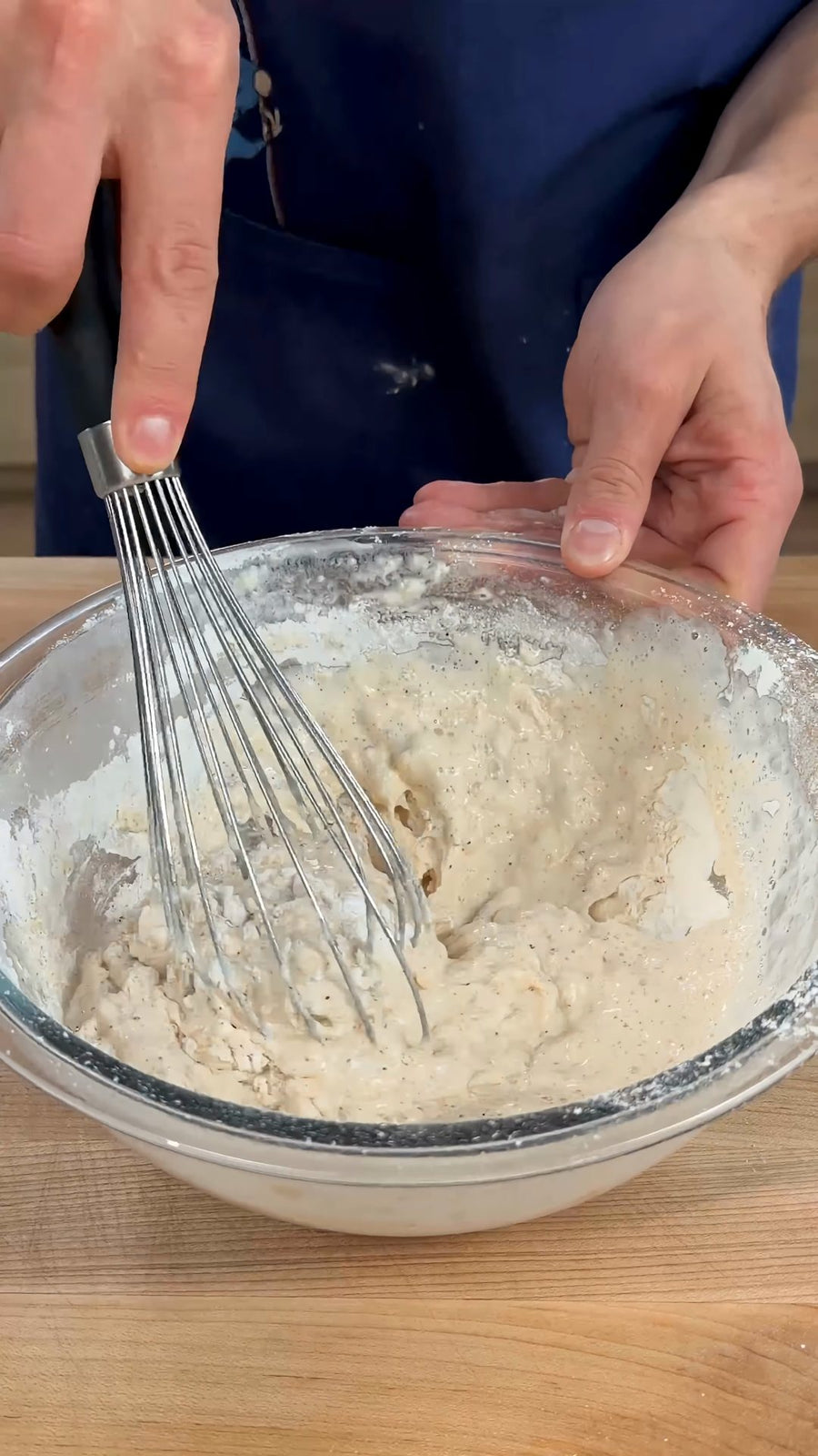 Nick whisks the wet and dry ingredients into batter.